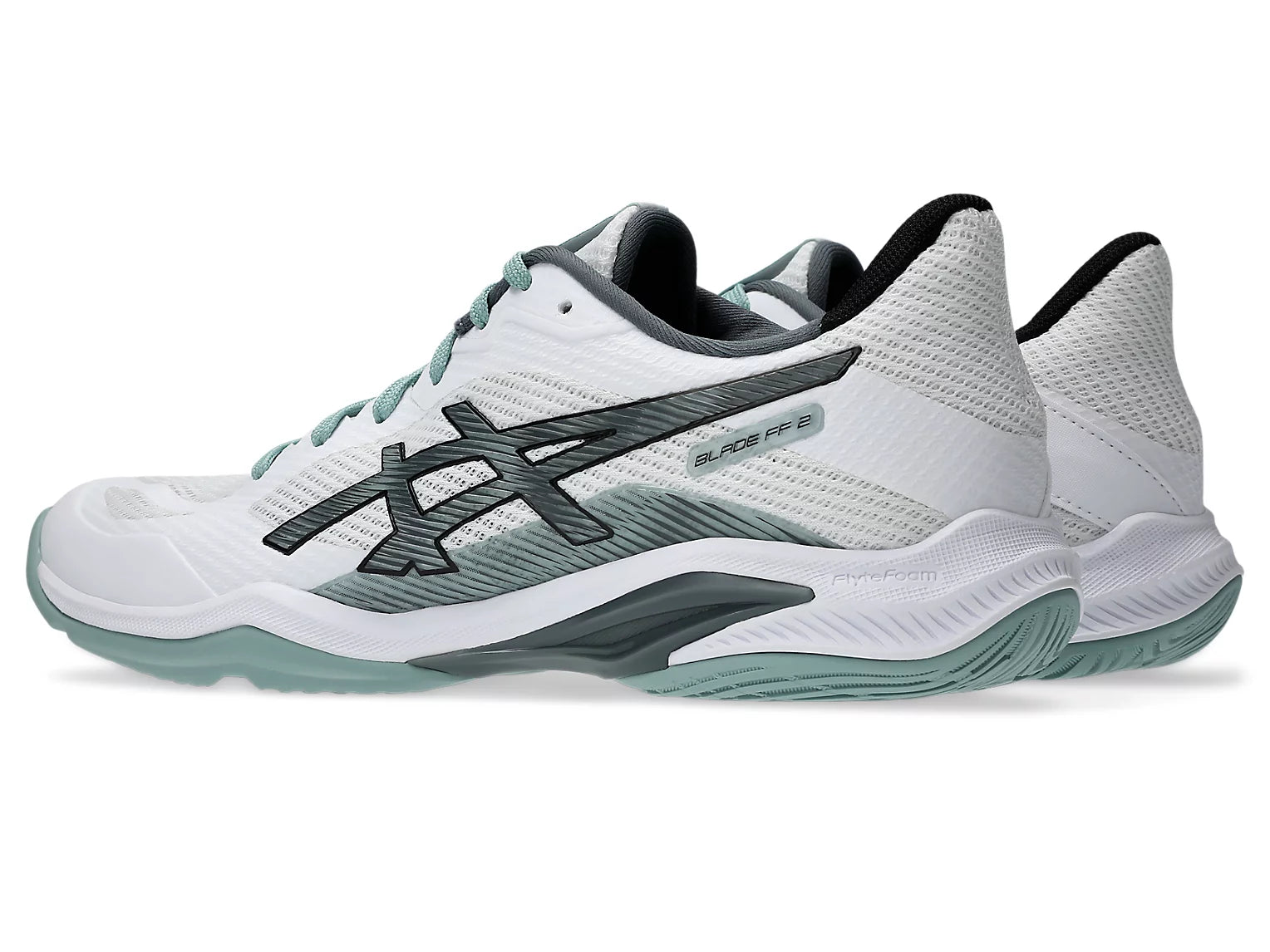 Innebandysko ASICS i vit och mint, sidovy med tydlig sulprofil